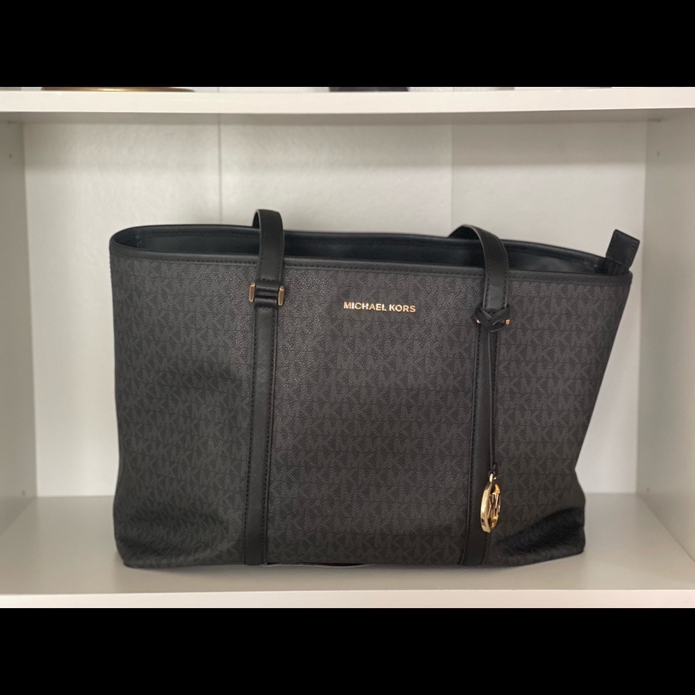 Black on black Authentic Micheal Kors bag. Used for work for a few months.